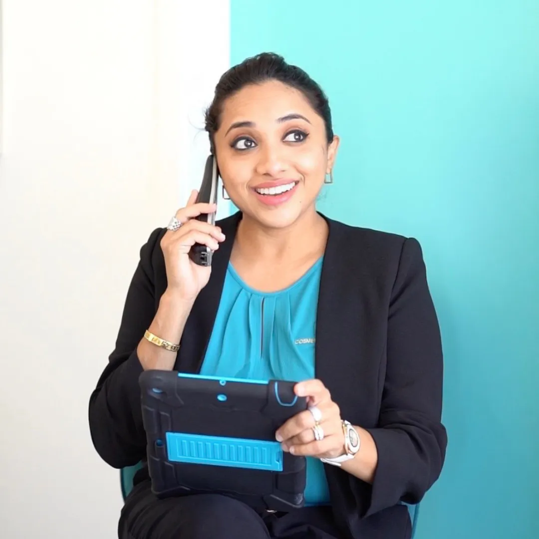 Nisla Rahim holding phone at NiZ Clinic, Gold Coast, Australia