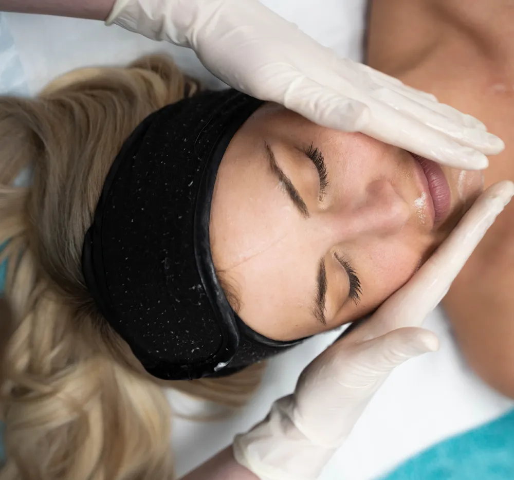 NiZ Clinic - A Model Woman receiving facial treatment at NiZ cosmetic and laser Clinic, gold coast - Australia.