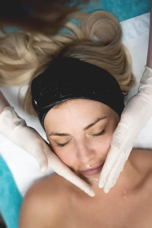 A female patient receiving facial therapy at NiZ Clinic, Gold coast - Australia
